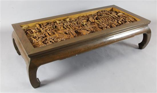 A Chinese hardwood and carved camphorwood kang table, second half 20th century, overall L.158cm H.41.5cm D.78cm